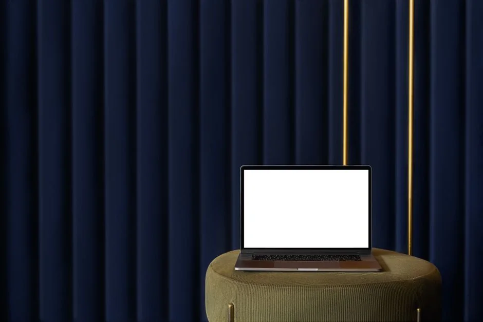 A modern workspace featuring dual computer monitors displaying web design projects, emphasizing technology and productivity.