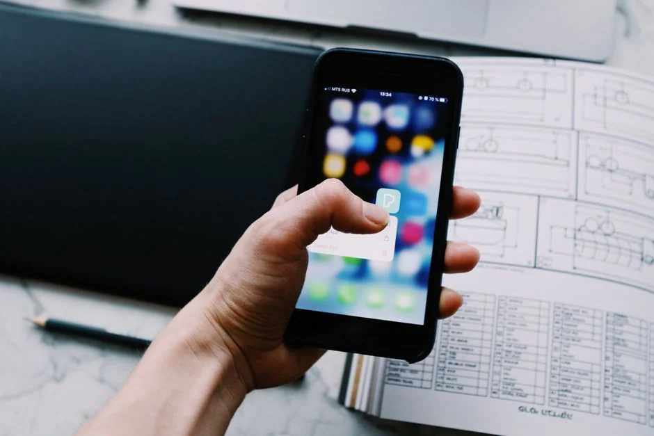 A modern work setup featuring a laptop, tablet, and smartphones, perfect for tech-focused and freelance work.